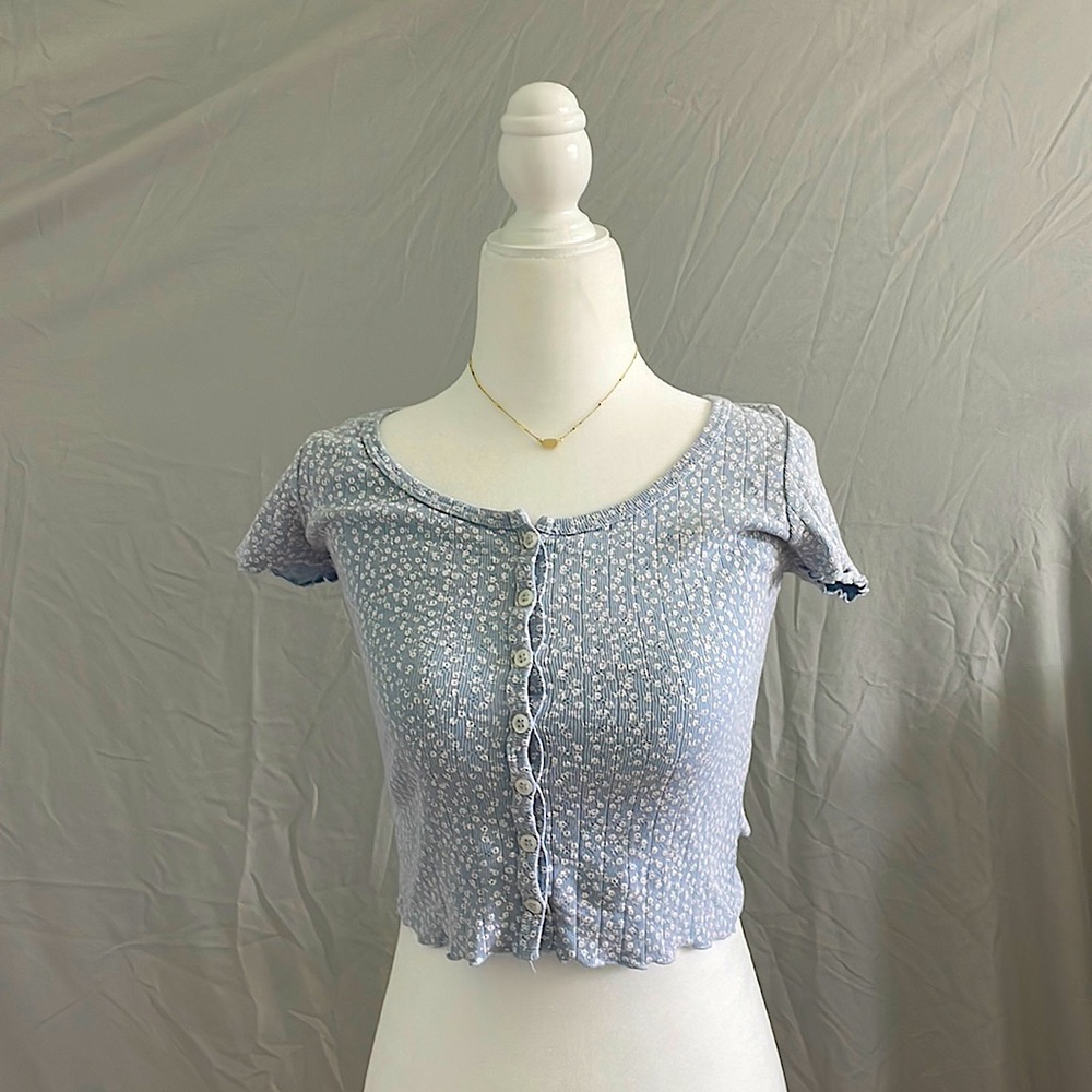 Light blue button down shirt with white flowers, no stains.